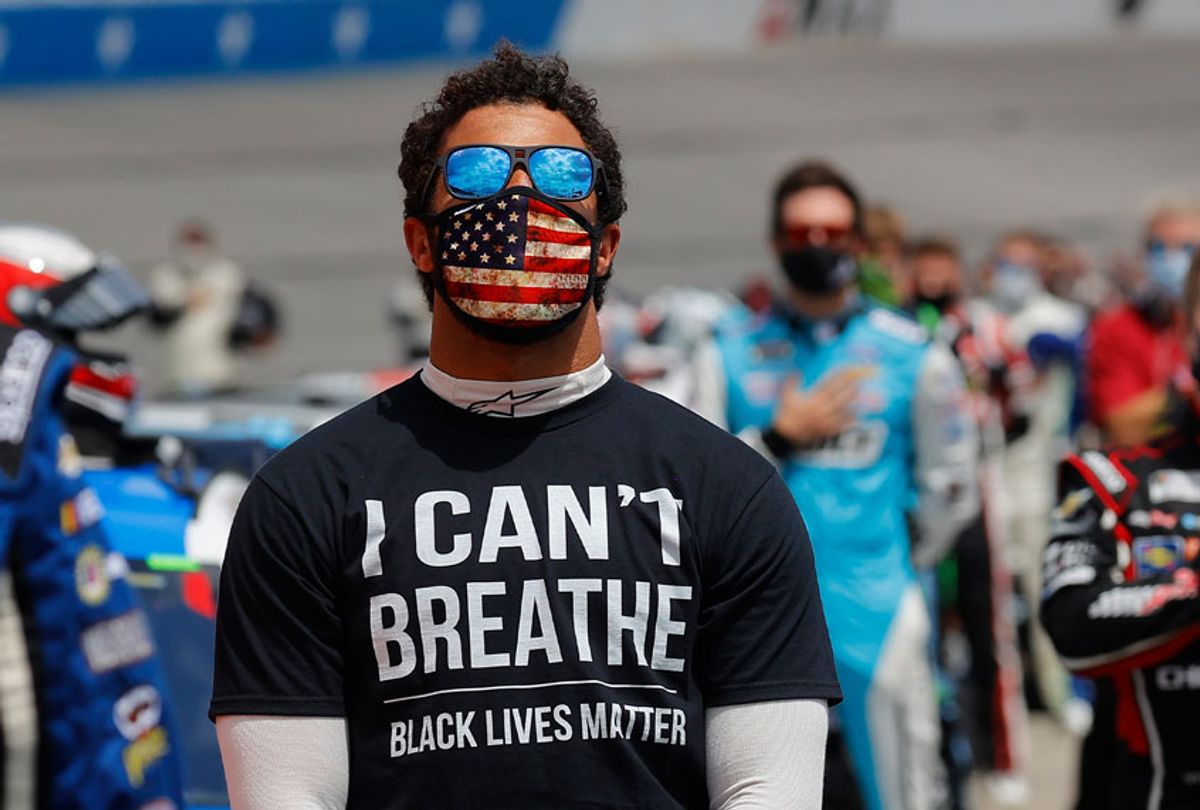 Bubba Wallace, driver of the #43 McDonald's Chevrolet, wears a "I Can't Breathe - Black Lives Matter" T-shirt under his fire suit in solidarity with protesters around the world taking to the streets after the death of George Floyd while in police custody. (Chris Graythen/Getty Images)