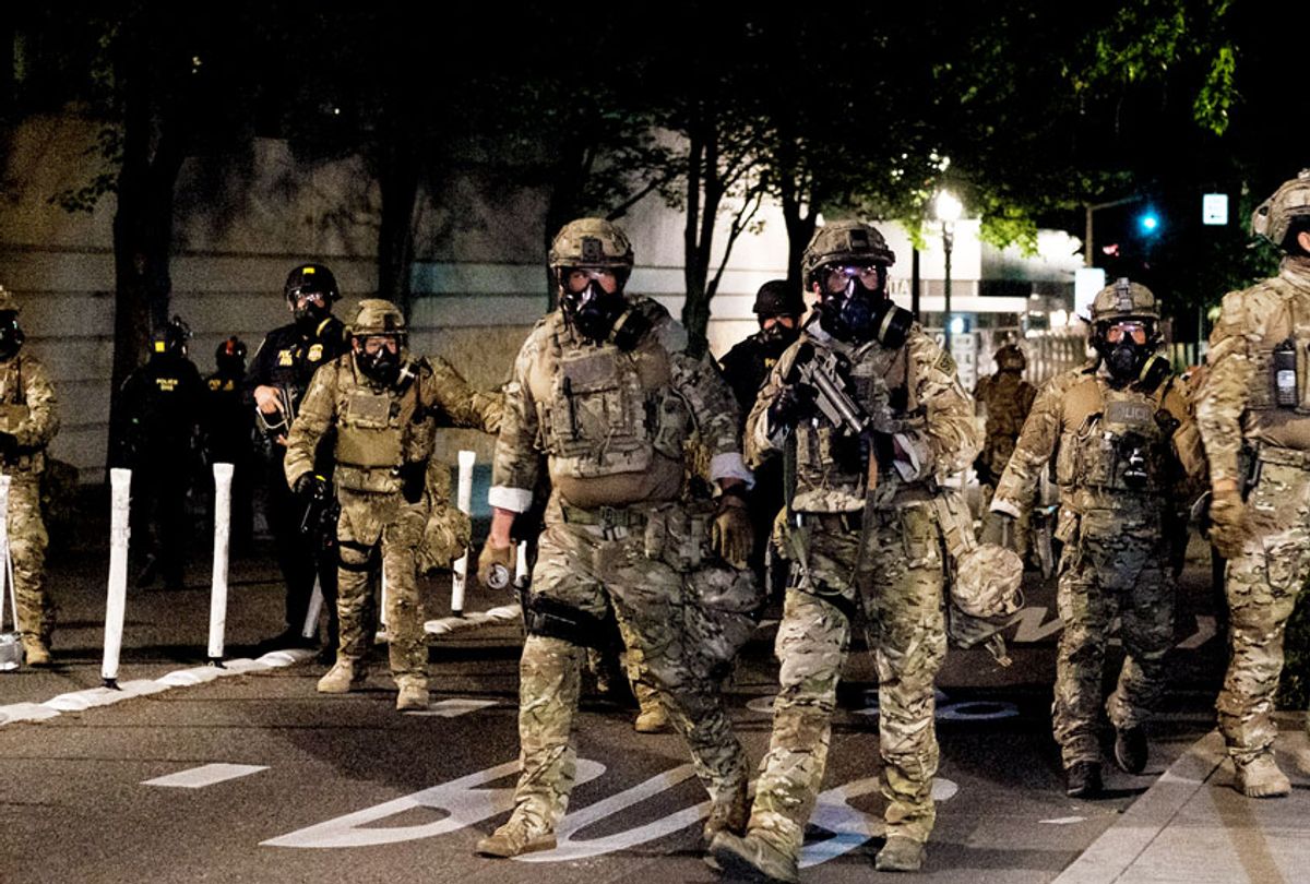 Federal officers prepare to disperse the crowd of protestors outside the Multnomah County Justice Center on July 17, 2020 in Portland, Oregon. Federal law enforcement agencies attempt to intervene as protests continue in Portland. (Mason Trinca/Getty Images)