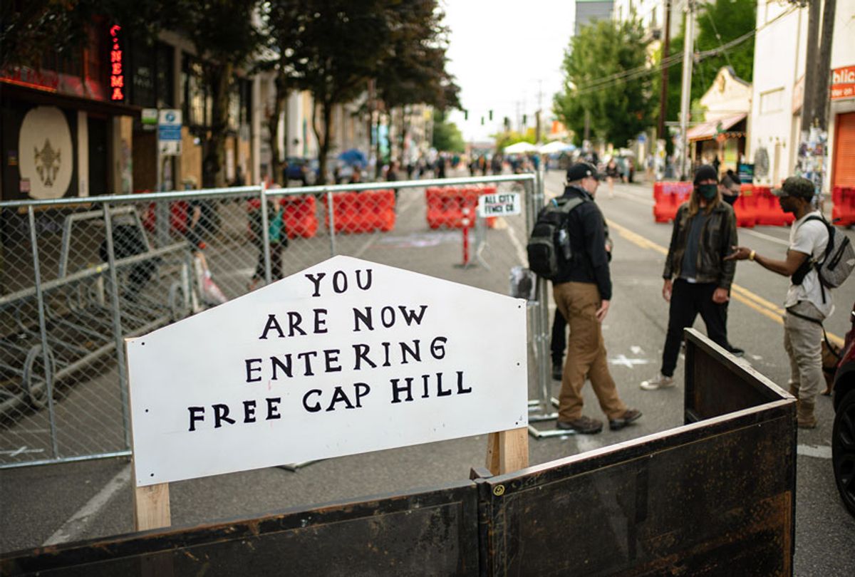  A sign is seen on a barrier at an entrance to the so-called "Capitol Hill Autonomous Zone" on June 10, 2020 in Seattle, Washington. The zone includes the blocks surrounding the Seattle Police Departments East Precinct, which was the site of violent clashes with Black Lives Matter protesters, who have continued to demonstrate in the wake of George Floyd's death. (David Ryder/Getty Images)