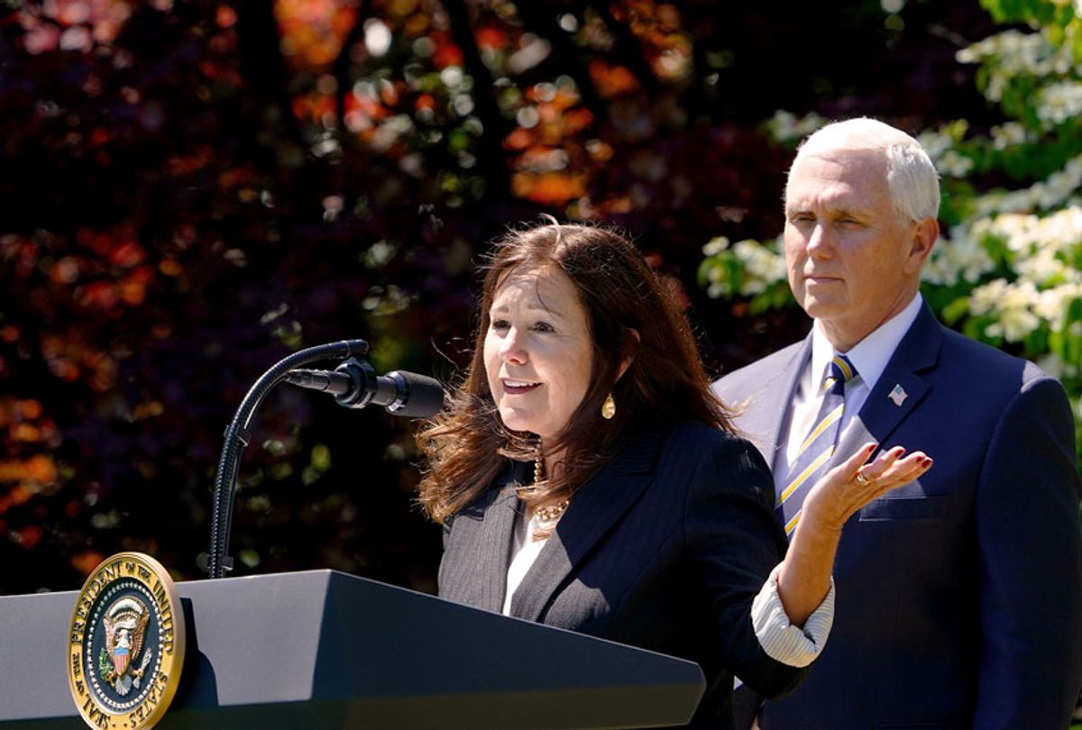 Vice President Mike Pence listens as his wife Karen Pence (MANDEL NGAN/AFP via Getty Images)