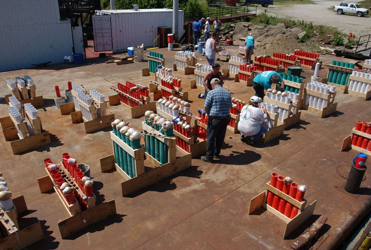 Pyrotechnicians prepare for a 4th of July fireworks show (David Greedy/Getty Images)