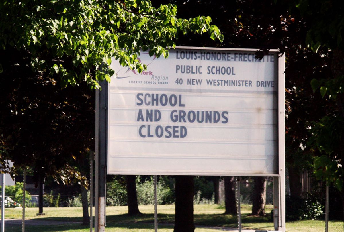 Sign outside a closed school during the novel coronavirus (COVID-19) (Creative Touch Imaging Ltd./NurPhoto via Getty Images)
