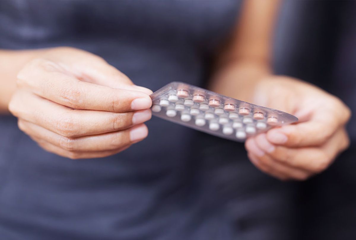 Woman Holding Blister Pack Of Pills (Getty Images)