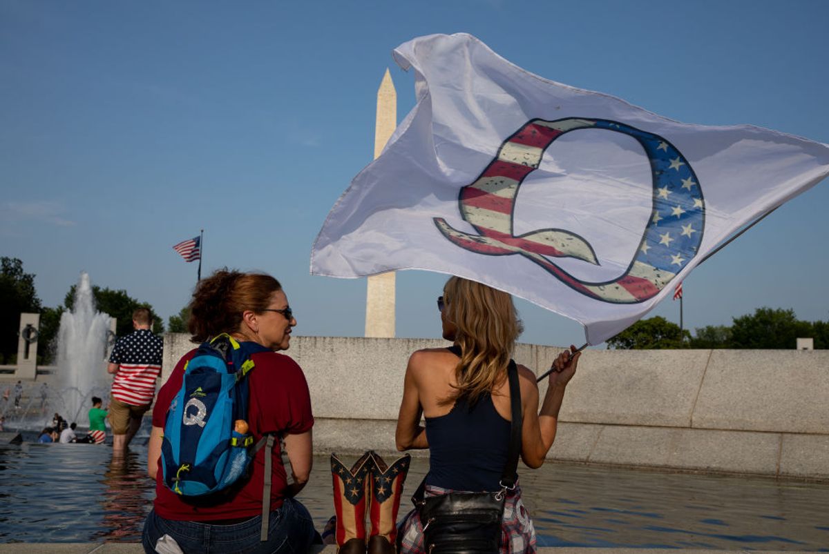 QAnon supporters wait for the military flyover at the World War II Memorial during Fourth of July celebrations in Washington, D.C. (Evelyn Hockstein/The Washington Post via Getty Images)