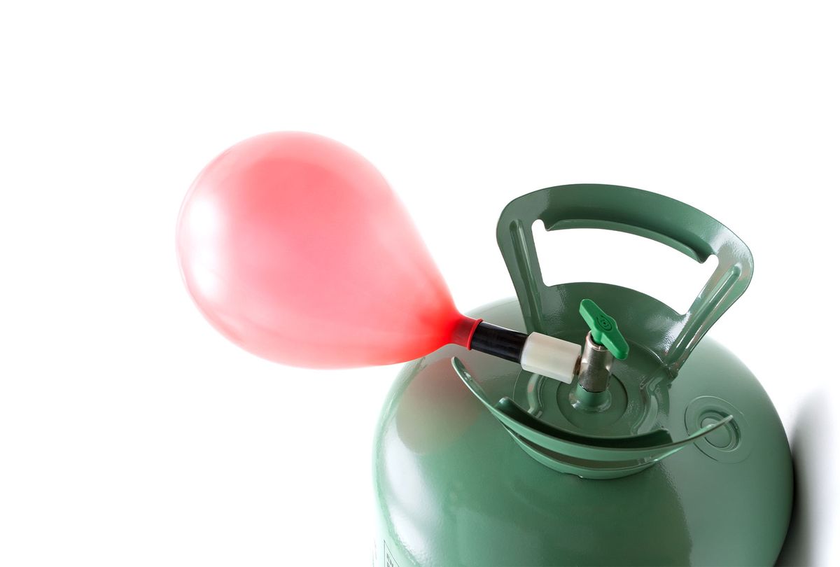 Helium gas cylinder and balloon (Getty Images)