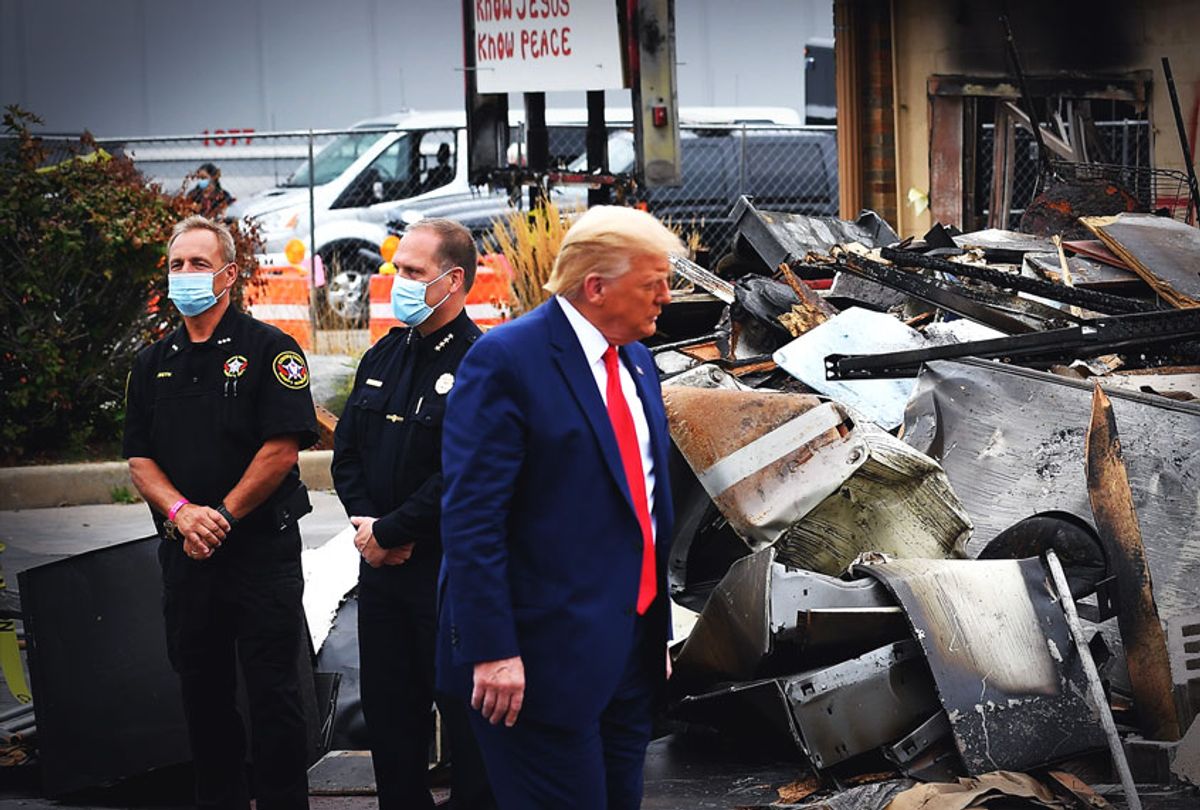 US President Donald Trump tours an area affected by civil unrest in Kenosha, Wisconsin on September 1, 2020. - Trump visited Kenosha, the Wisconsin city at the center of a raging US debate over racism, despite pleas to stay away and claims he is dangerously fanning tensions as a reelection ploy. (MANDEL NGAN/AFP via Getty Images)