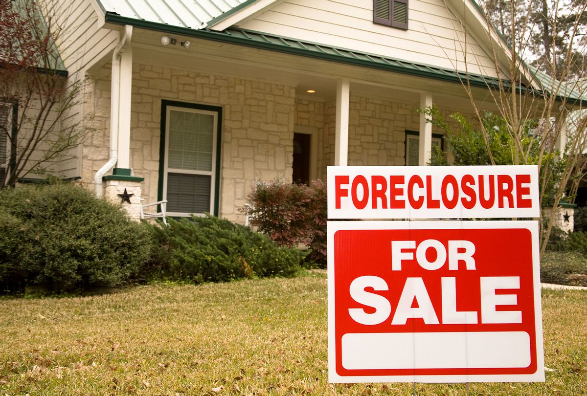 Foreclosure for sale sign in front of house  (Getty Images)