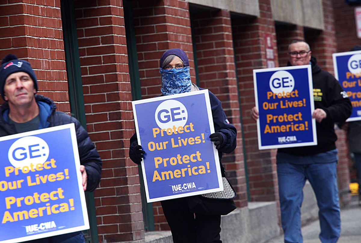 General Electric workers hold a protest on Necco Street in Boston, MA out of concerns for their safety on March 30, 2020. The machinists, hand-tool operators, and inspectors who build jet and helicopter engines for the US military were concerned that their shared workstations werent being sanitized between around-the-clock shifts while the highly contagious coronavirus ravages the country, according to their union. (Suzanne Kreiter/The Boston Globe via Getty Images)