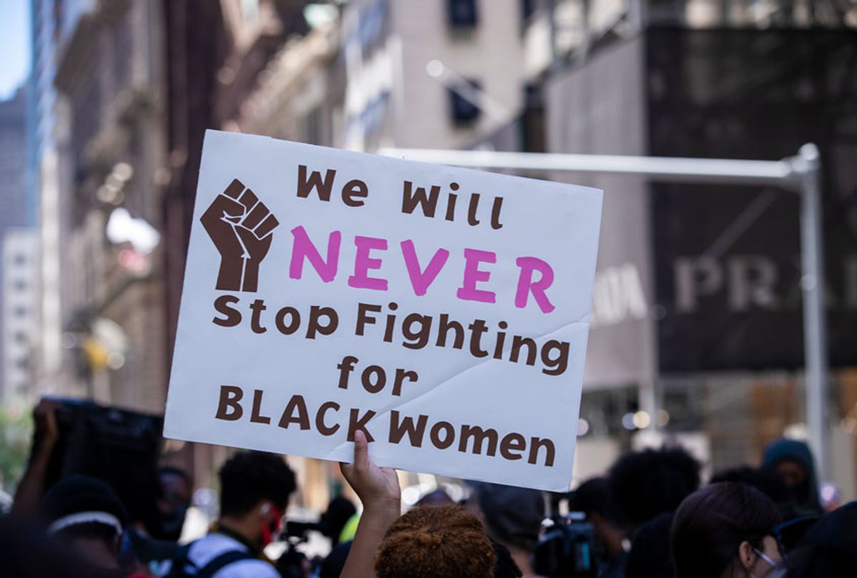 A protester holds up their homemade sign that says, "We Will NEVER Stop Fighting for BLACK Women" with a picture of the black power fist on the sign during a protest at Trump Tower. This was part of the Black Womxn's Empowerment March that started at Trump Tower and marched to Gracie Mansion. (Ira L. Black/Corbis via Getty Images)