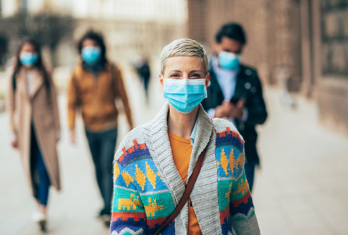 Woman with face protective mask (Getty Images)