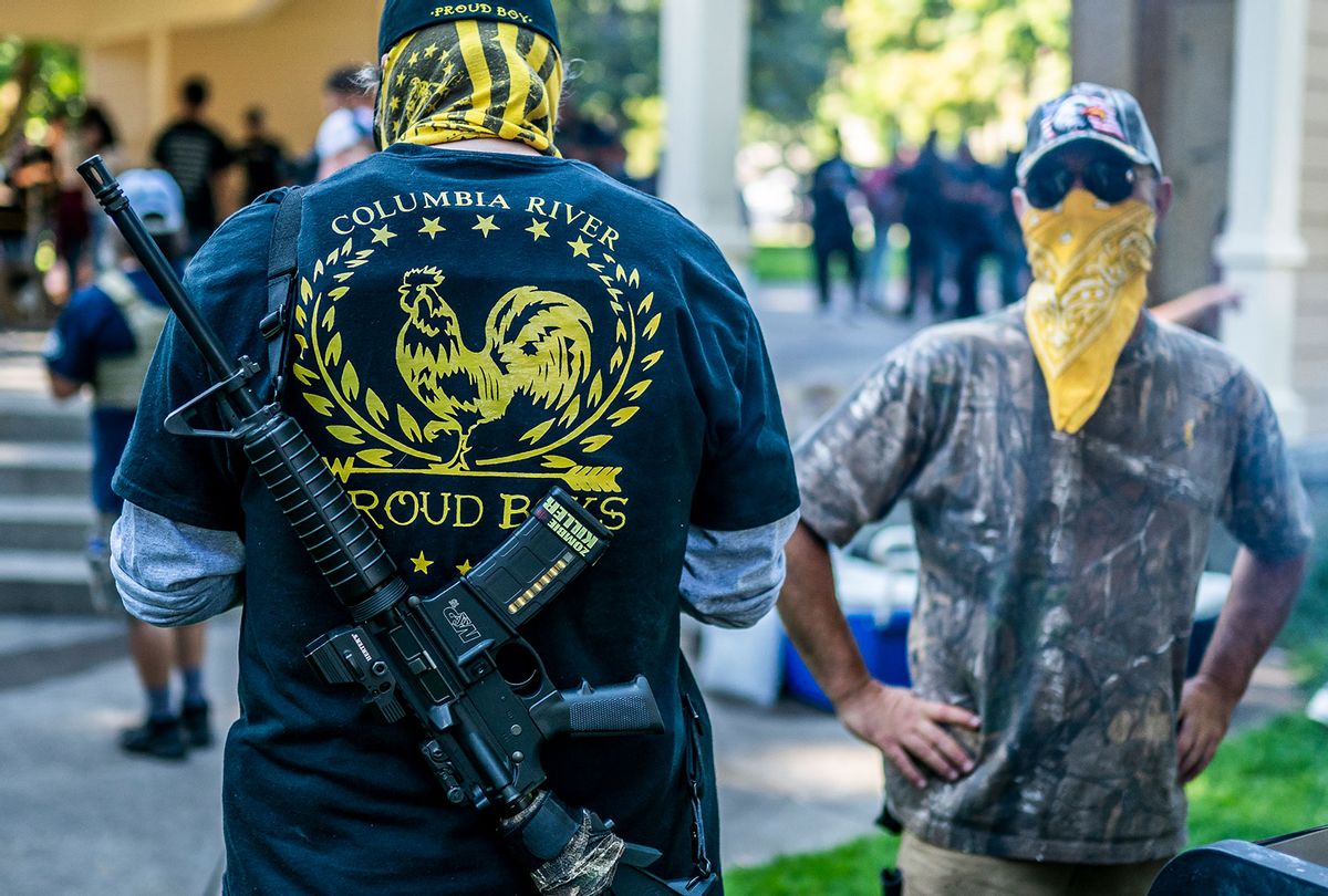 Armed members of the far-right Proud Boys groups stand guard during a memorial for Patriot Prayer member Aaron Jay Danielson on September 5, 2020 in Vancouver, Washington. Danielson was shot and killed on Saturday, August 29 during a pro-Trump rally in Portland, Oregon. (Nathan Howard/Getty Images)