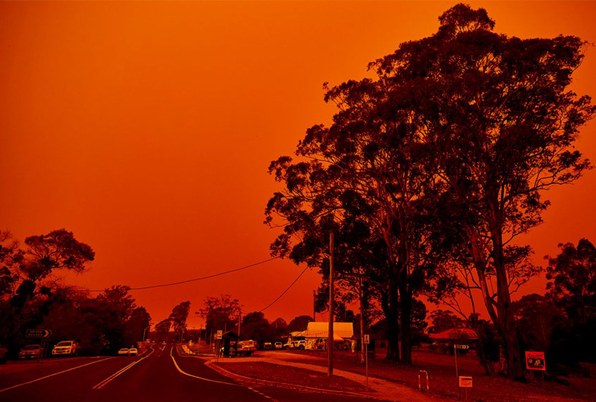 The sky turns red over the town on January 04, 2020 in Bodalla, Australia. A state of emergency has been declared across NSW with dangerous fire conditions forecast for Saturday, as more than 140 bushfires continue to burn. (Brett Hemmings/Getty Images)