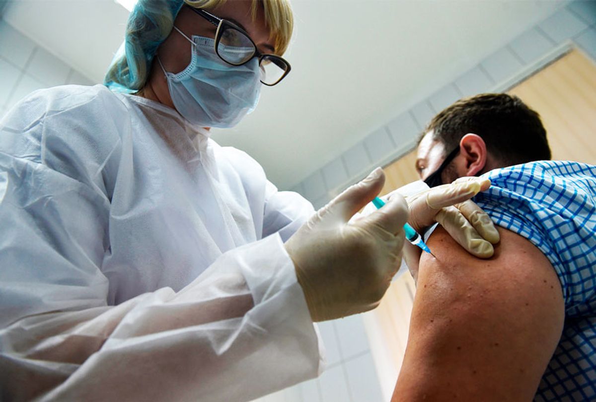 A nurse inoculates volunteer Ilya Dubrovin, 36, with Russia's new coronavirus vaccine in a post-registration trials at a clinic in Moscow on September 10, 2020. (Getty Images)