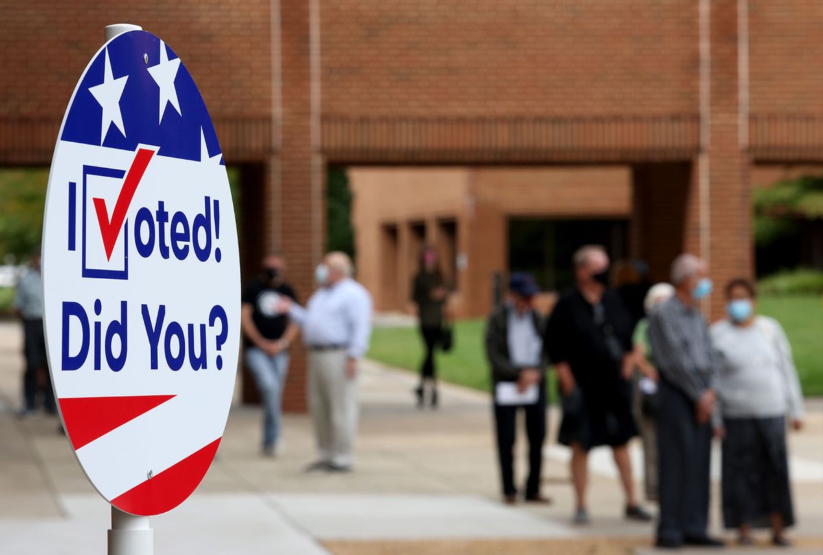 Voters in Virginia's 7th district wait in line to vote at the Henrico County Registrar’s office September 18, 2020 in Henrico, Virginia. Today marks the beginning of Virginia’s early voting program that continues through October 31. (Win McNamee/Getty Images)