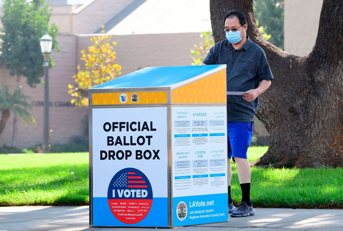 A ballot is dropped off at an official Vote by Mail Drop Box for the 2020 US Elections on October 5, 2020 in Monterey Park, California, on the first day drop boxes are available to voters. (FREDERIC J. BROWN/AFP via Getty Images)