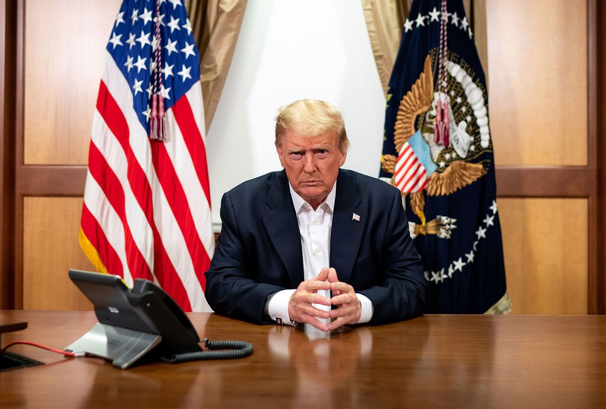 In this handout provided by The White House, President Donald Trump participates in a phone call with Vice President Mike Pence, Secretary of State Mike Pompeo, and Chairman of the Joint Chiefs of Staff Gen. Mark Milley in his conference room at Walter Reed National Military Medical Center on October 4, 2020 in Bethesda, Maryland. (Tia Dufour/The White House via Getty Images)