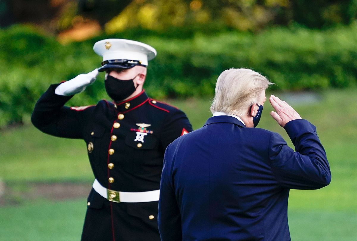 U.S. President Donald Trump salutes as he prepares to board Marine One for Walter Reed National Military Medical Center on the South Lawn of the White House on October 2, 2020 in Washington, DC. President Donald Trump and First Lady Melania Trump have both tested positive for coronavirus. (Drew Angerer/Getty Images)