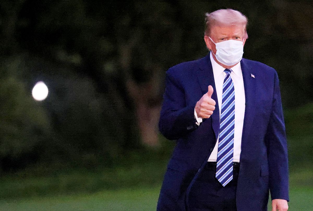 U.S. President Donald Trump gestures upon return to the White House from Walter Reed National Military Medical Center on October 05, 2020 in Washington, DC. Trump spent three days hospitalized for coronavirus. (Win McNamee/Getty Images)