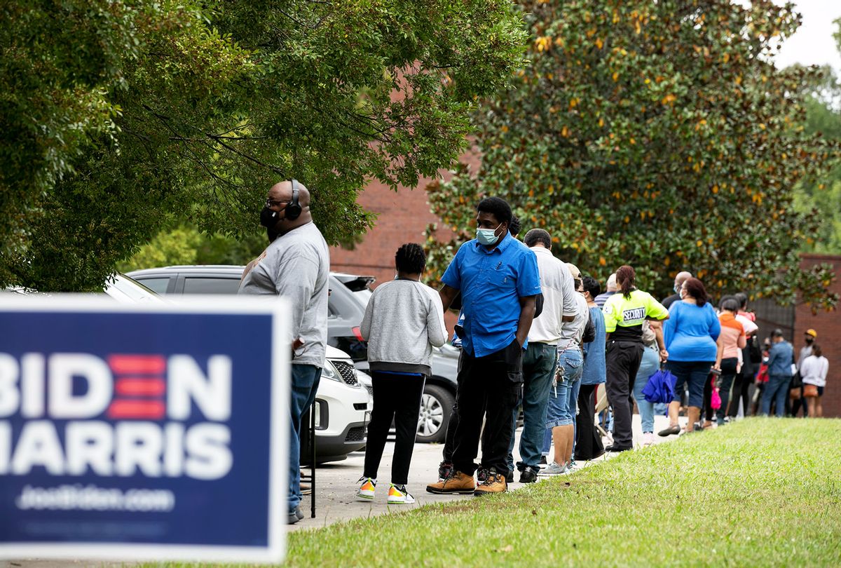 People stand in line on the first day of early voting for the general election at the C.T. Martin Natatorium and Recreation Center on October 12, 2020 in Atlanta, Georgia. (Jessica McGowan/Getty Images)