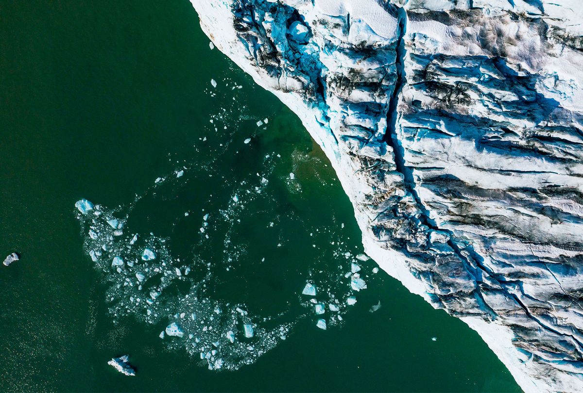 An aerial picture shows bergy bits and growlers floating in front of the Apusiajik glacier, near Kulusuk (aslo spelled Qulusuk), a settlement in the Sermersooq municipality located on the island of the same name on the southeastern shore of Greenland. (JONATHAN NACKSTRAND/AFP via Getty Images)