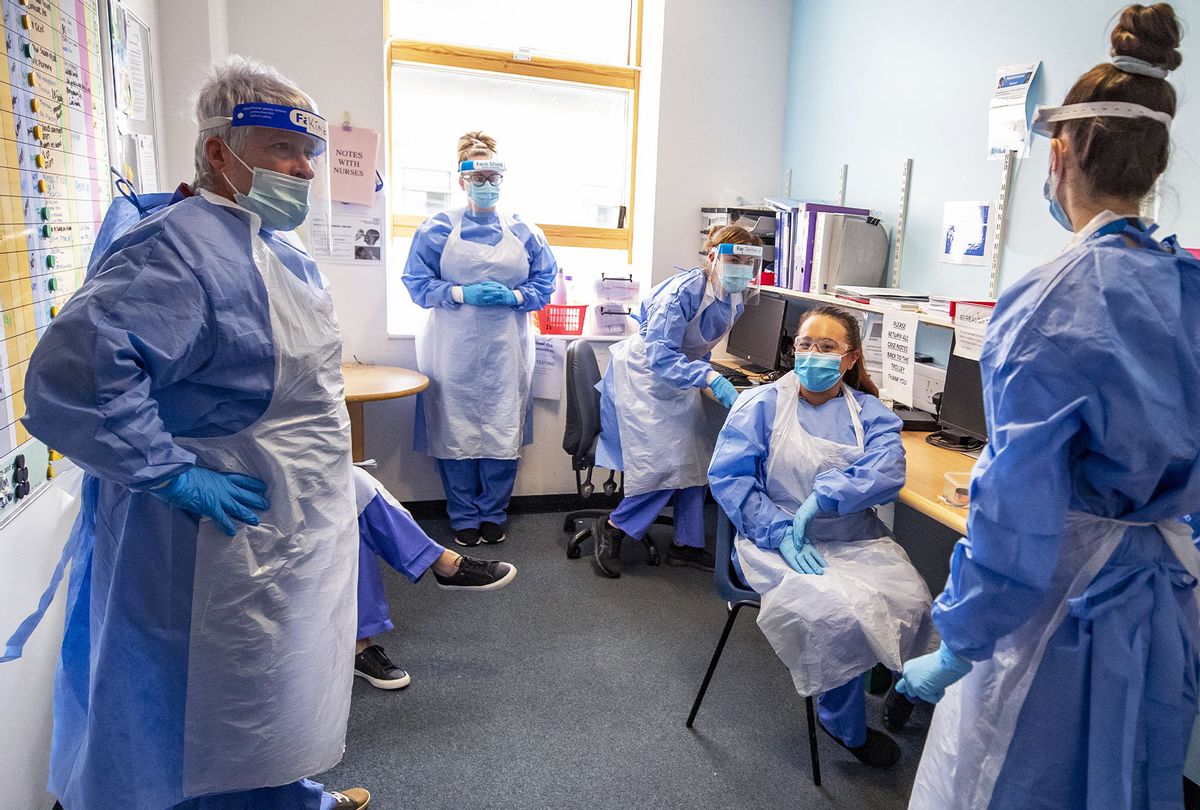 Nurses hold a meeting on one of five Covid-19 wards at Whiston Hospital in Merseyside where patients are taken to recover from the virus. (Peter Byrne/PA Images via Getty Images)