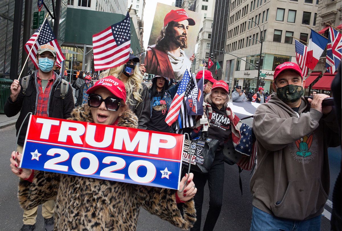 Trump supporters rally in front of Trump Tower and march down 5th Avenue on October 25, 2020 in New York City. As the Presidential election approaches, Trump supporters are becoming more visible, with frequent rallies and caravans. (Andrew Lichtenstein/Corbis via Getty Images)