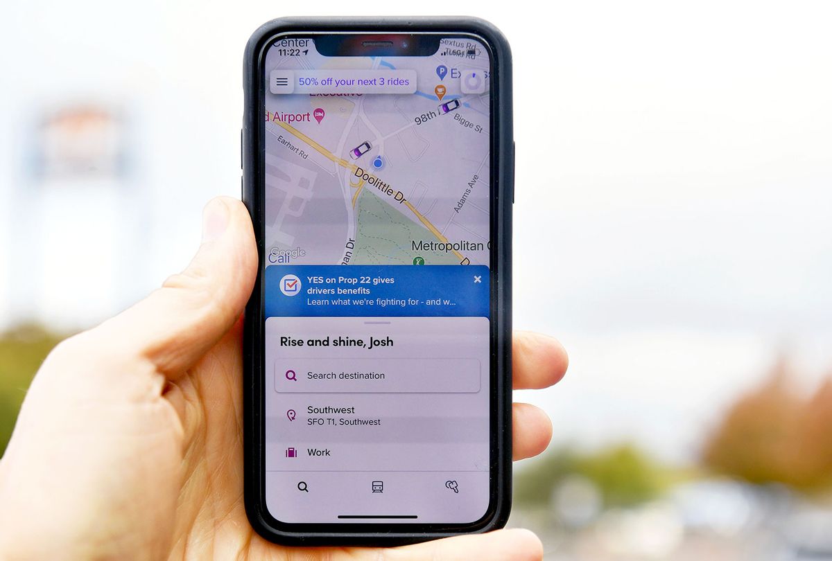 A smartphone's Lyft app displays a message motivating users to vote yes on Proposition 22 in Oakland, California on October 9, 2020. (JOSH EDELSON/AFP via Getty Images)
