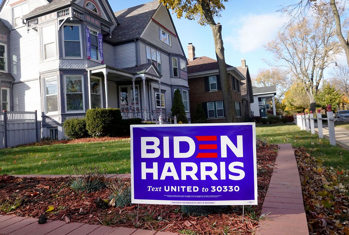 A campaign sign supporting Democratic presidential nominee Joe Biden and his running mate Sen. Kamala Harris (D-CA) sits in the front yard of a home on November 01, 2020 in Racine, Wisconsin. Today is the final day for early voting in Wisconsin, a state which President Donald Trump won with less than 1 percent of the vote in 2016. (Scott Olson/Getty Images)