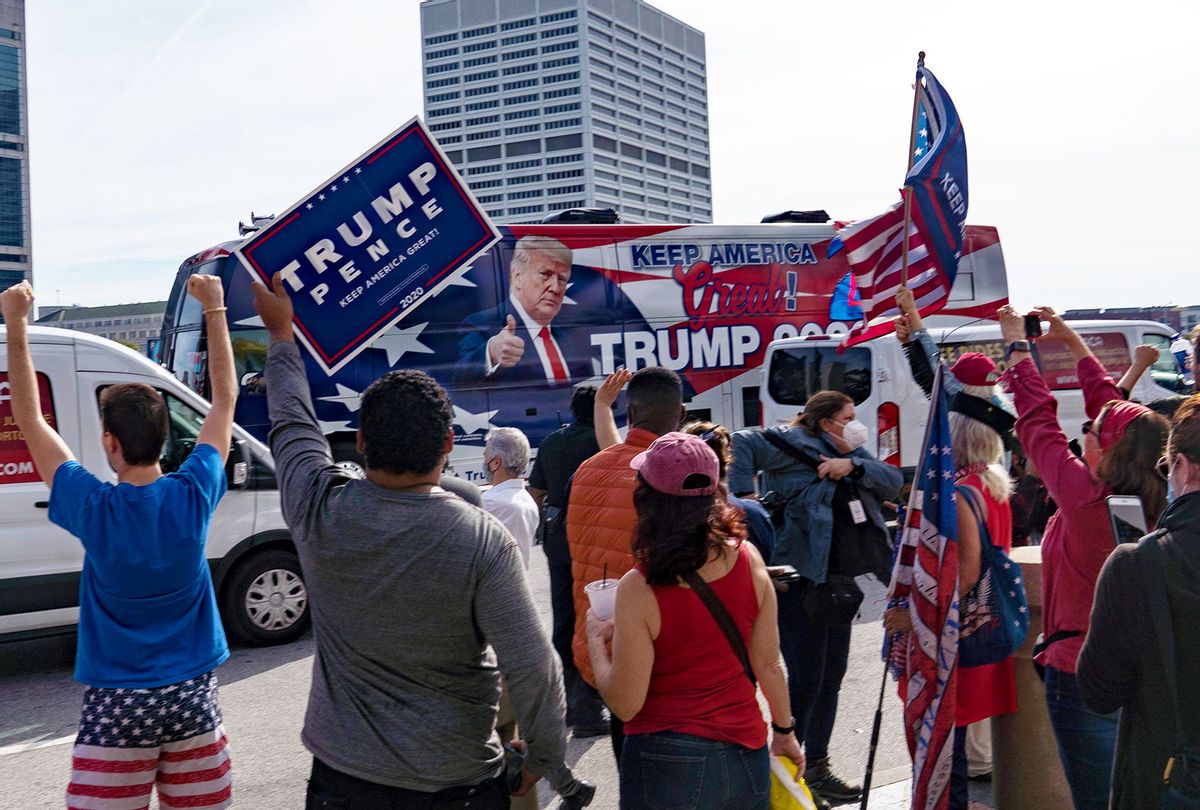 A Trump Bus drives by supporters of President Donald Trump protest outside State Farm Arena as ballots continue to be counted inside on November 5, 2020 in Atlanta, Georgia. Attention is focused on a few key battleground states as the U.S. presidential election remains too close to call. (Megan Varner/Getty Images)