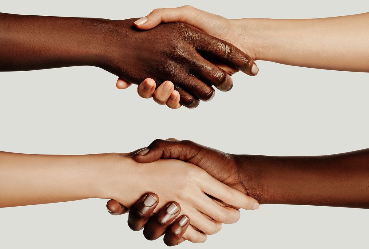 Interracial Handshake (Getty Images)