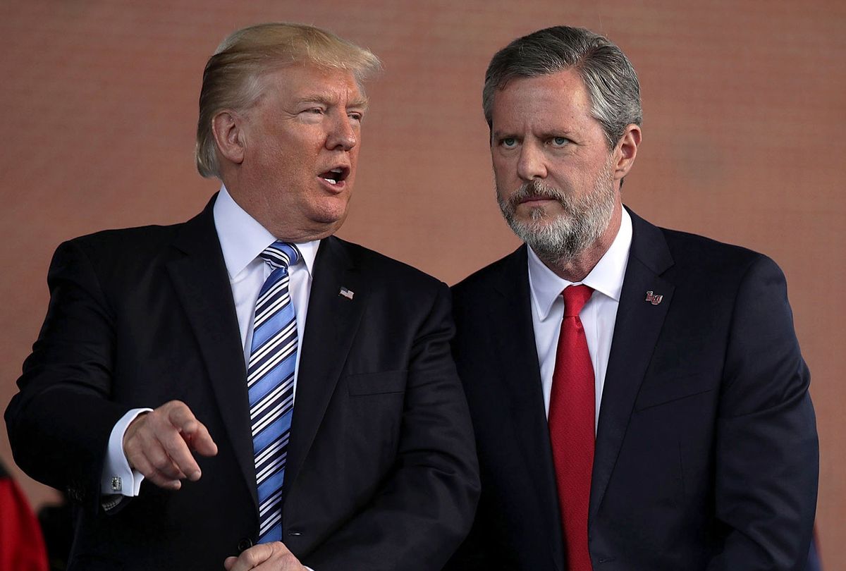 President Donald Trump (L) and Jerry Falwell (R), President of Liberty University, on stage during a commencement at Liberty University May 13, 2017 in Lynchburg, Virginia. President Trump is the first sitting president to speak at Liberty's commencement since George H.W. Bush spoke in 1990. (Alex Wong/Getty Images)