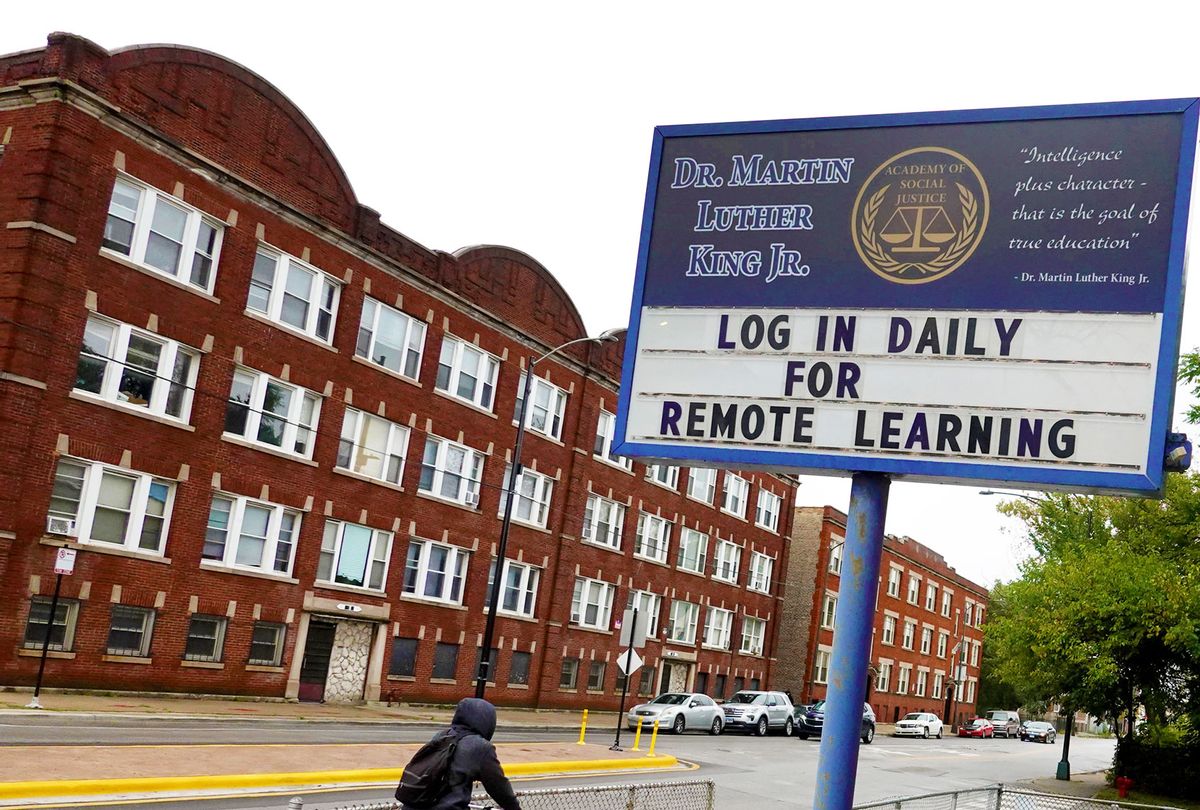 A sign in front of King Elementary School encourages students to participate in remote learning on September 08, 2020 in Chicago, Illinois. Students at King Elementary and the rest of Chicago public schools started classes today with students being taught remotely because of COVID-19 concerns. (Scott Olson/Getty Images)
