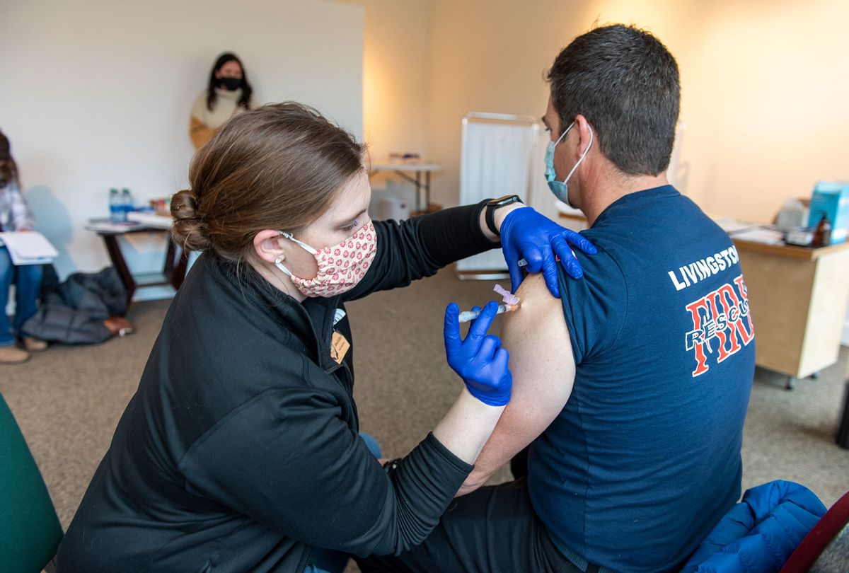 EMT Matt Johnson of Livingston Fire and Rescue receives a Moderna COVID-19 vaccination at the Park County Health Departments storefront clinic on January 5, 2021 in Livingston, Montana. (William Campbell/Getty Images)