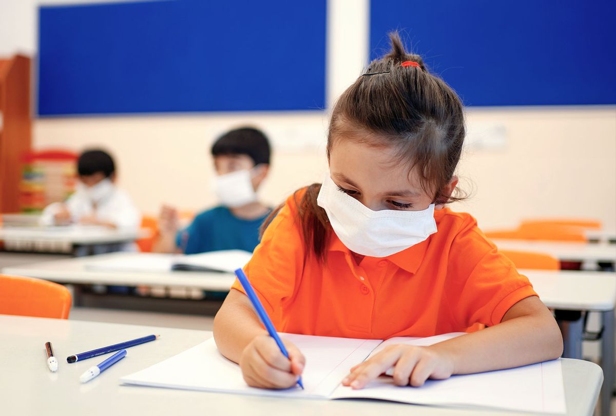 Child with face mask back at school after covid-19 quarantine and lockdown (Getty Images)