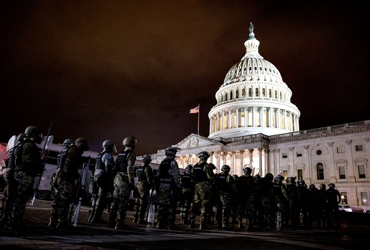 Members of the National Guard and the Washington D.C. police stand guard to keep demonstrators away from the U.S. Capitol on January 06, 2021 in Washington, DC. A pro-Trump mob stormed the Capitol earlier, breaking windows and clashing with police officers. Trump supporters gathered in the nation's capital to protest the ratification of President-elect Joe Biden's Electoral College victory over President Donald Trump in the 2020 election. (Samuel Corum/Getty Images)