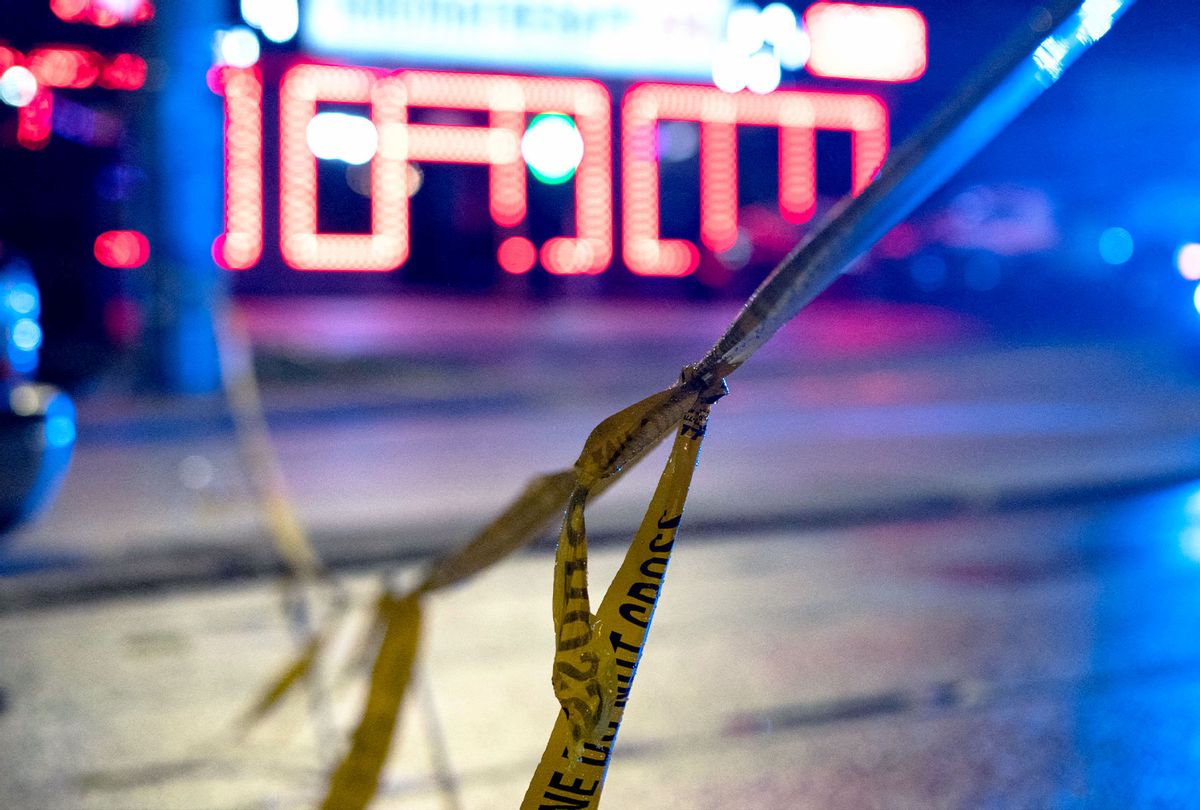 Police tape is seen outside a massage parlor where a person was shot and killed on March 16, 2021, in Atlanta, Georgia. - Eight people were killed in shootings at three different spas in the US state of Georgia on March 16 and a 21-year-old male suspect was in custody, police and local media reported, though it was unclear if the attacks were related. (ELIJAH NOUVELAGE/AFP via Getty Images)