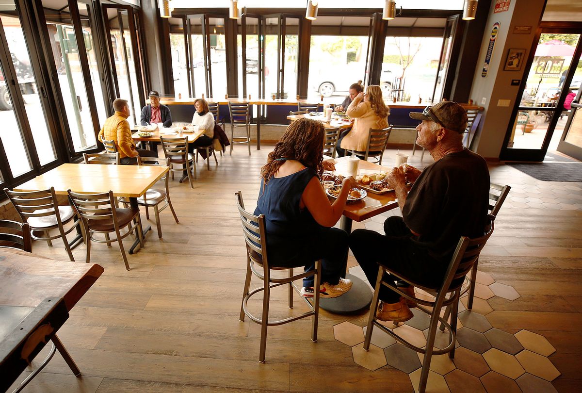 David Miller and Angie Hagans eat their favorite meal after waiting one year to dine inside Mos Smokehouse BBQ in downtown San Luis Obispo as San Luis Obispo county moved into the red tier that allows for indoor dining and gym reopening. Its one of our favorite restaurants. We ran over when we heard they were open, said David Miller. Mos Smokehouse BBQ general manager Nancy Snyder said, We were ready and excited to open. downtown on Wednesday, March 3, 2021 in San Luis Obispo, CA. (Al Seib / Los Angeles Times via Getty Images)