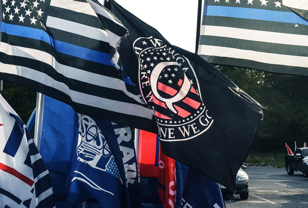 A flag for the QAnon conspiracy theory is flown with other right wing flags during a pro-Trump rally on October 11, 2020 in Ronkonkoma, New York. (Stephanie Keith/Getty Images)