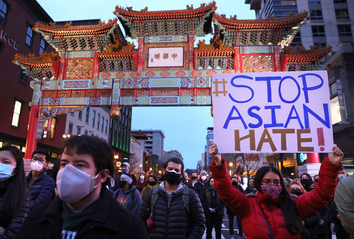 Activists participate in a vigil in response to the Atlanta spa shootings March 17, 2021 in the Chinatown area of Washington, DC. A gunman opened fire in three spas in the Atlanta, Georgia area, the day before killing eight people, including six women of Asian descent. (Alex Wong/Getty Images)