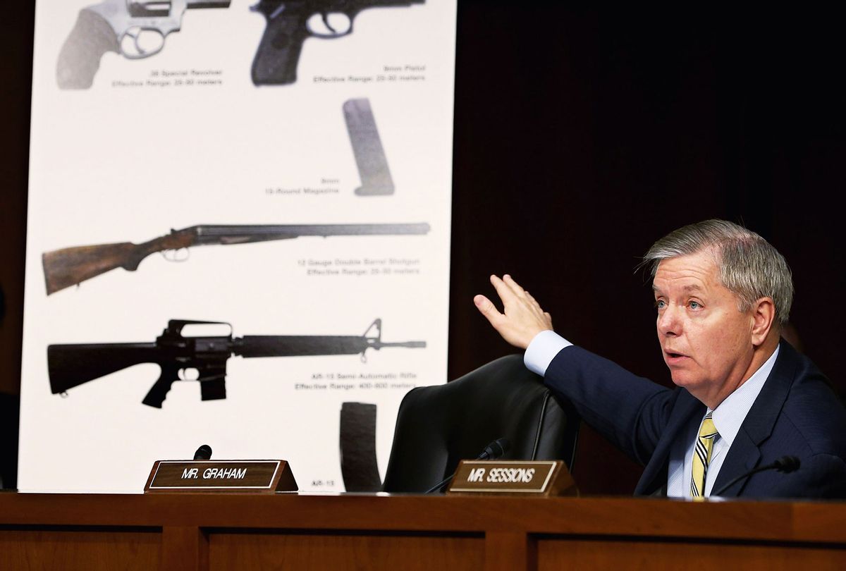 Senate Judiciary Committee member Sen. Lindsey Graham (R-SC) uses imagees of handguns and rifles during a hearing about gun control on Capitol Hill January 30, 2013 in Washington, DC. Shooting victim and former U.S. Rep. Gabby Giffords (D-AZ) delivered an opening statment to the committee, which met for the first time since the mass shooting at a Sandy Hook Elementary School in Newtown, Connecticut. (Chip Somodevilla/Getty Images)