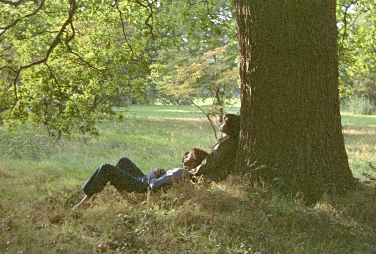 Restored from the original Kodak 126 Instamatic square-format negaive, this photograph was used as the cover shot for the original twelve-inch vinyl LP John Lennon / Plastic Ono Band. Based on an original drawing by John, it features John & Yoko photographed underneath a huge oak tree in the gardens of their home at Tittenhurst Park, Ascot, Berkshire, autumn 1970. For the cover of the companion album, Yoko Ono / Plastic Ono Band, John & Yoko swapped positions. (Dan Richter/Universal Music Group)