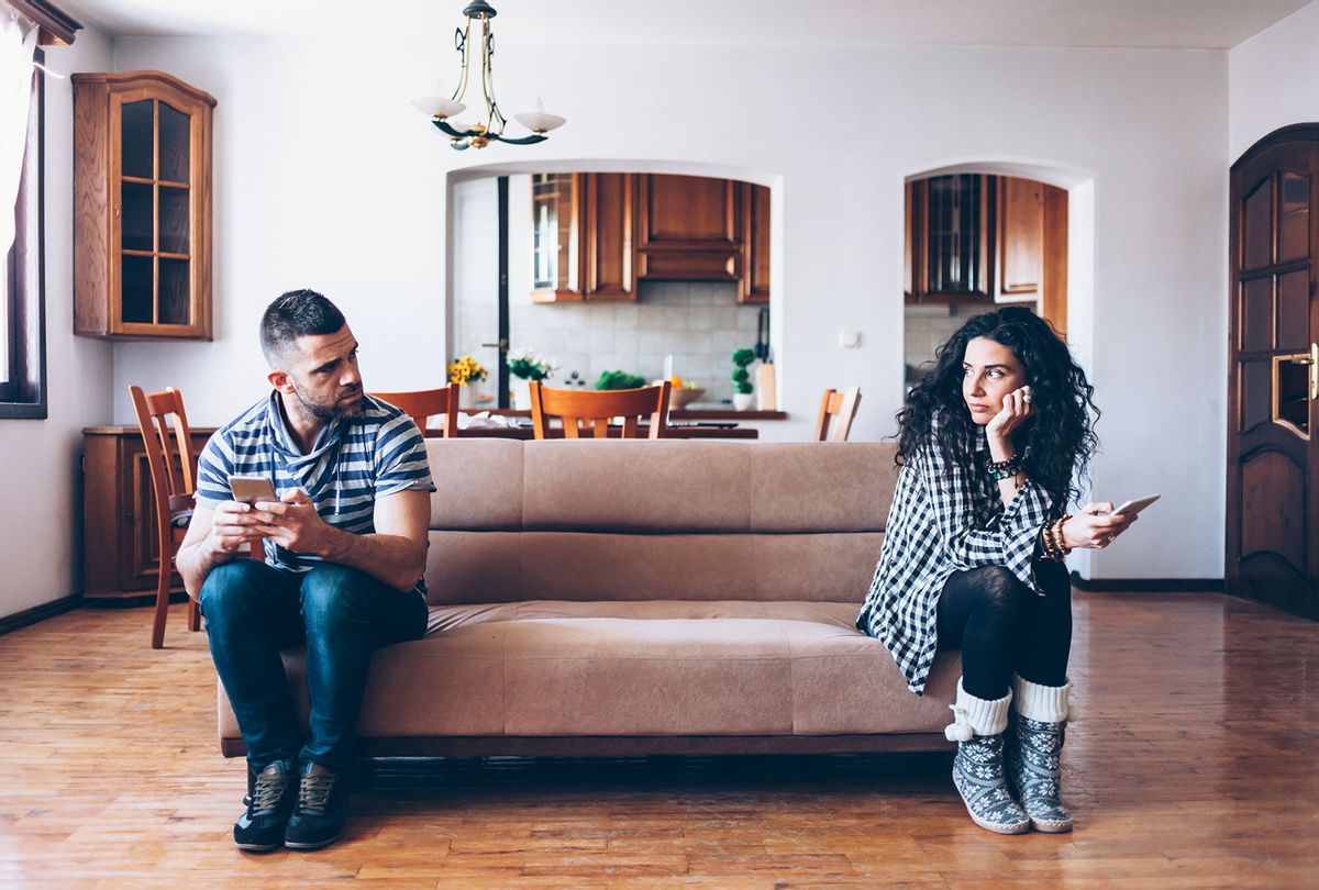 Couple with relationship difficulties sitting on sofa (Getty Images)