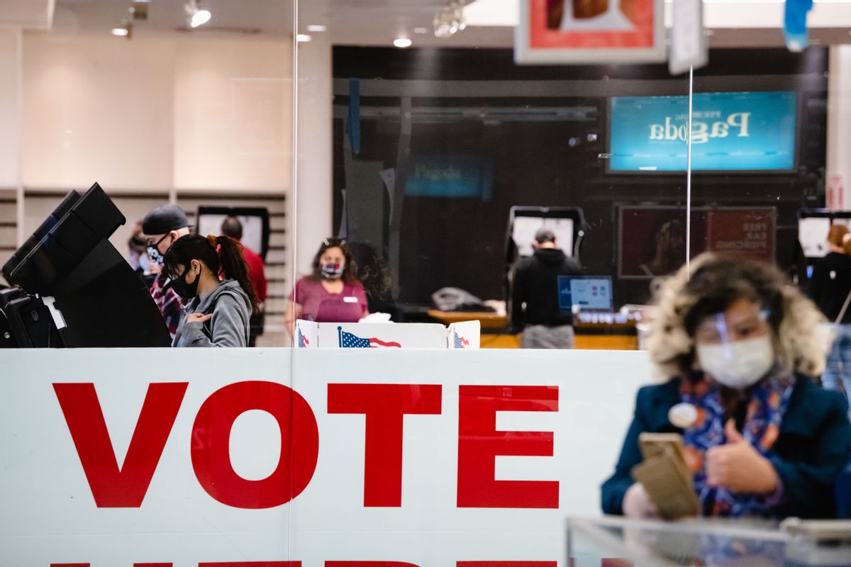 A woman casts her ballot inside the Basset Place Mall in El Paso, Texas on November 3, 2020. (Justin HAMEL / AFP)