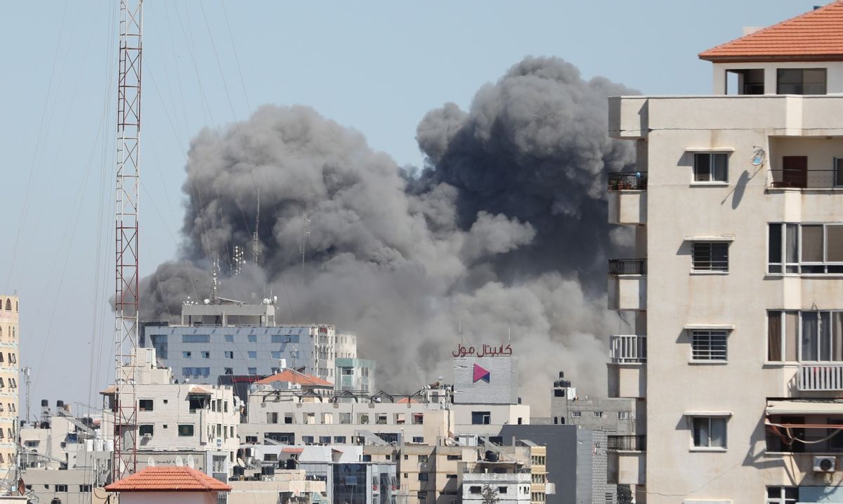 Smoke rises after Israeli forces destroyed a building in Gaza City where Al-Jazeera and The Associated Press had their offices. (Mustafa Hassona/Anadolu Agency via Getty Images)