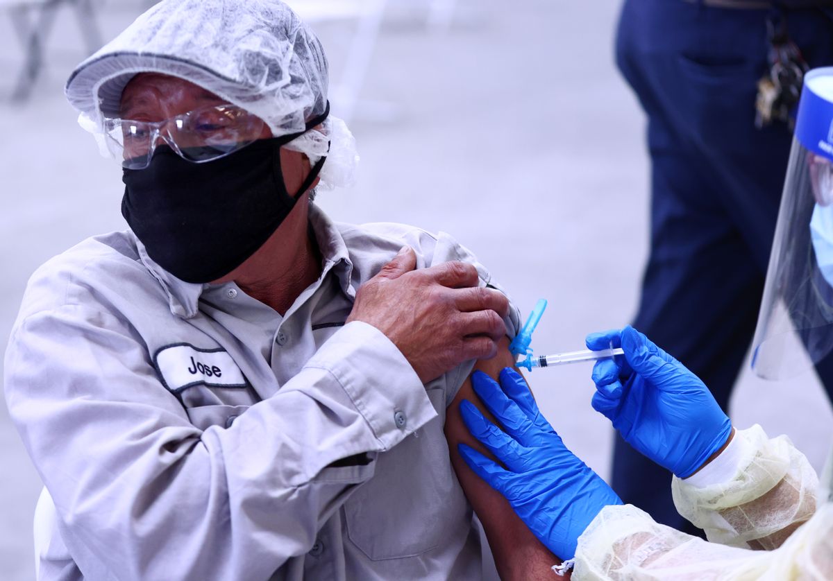 Jose Ortiz receives a one-shot dose of the Johnson & Johnson COVID-19 vaccine at a clinic geared toward agriculture workers organized by the immigrant advocacy group TODEC on April 5, 2021, in Riverside, California. (Mario Tama/Getty Images)
