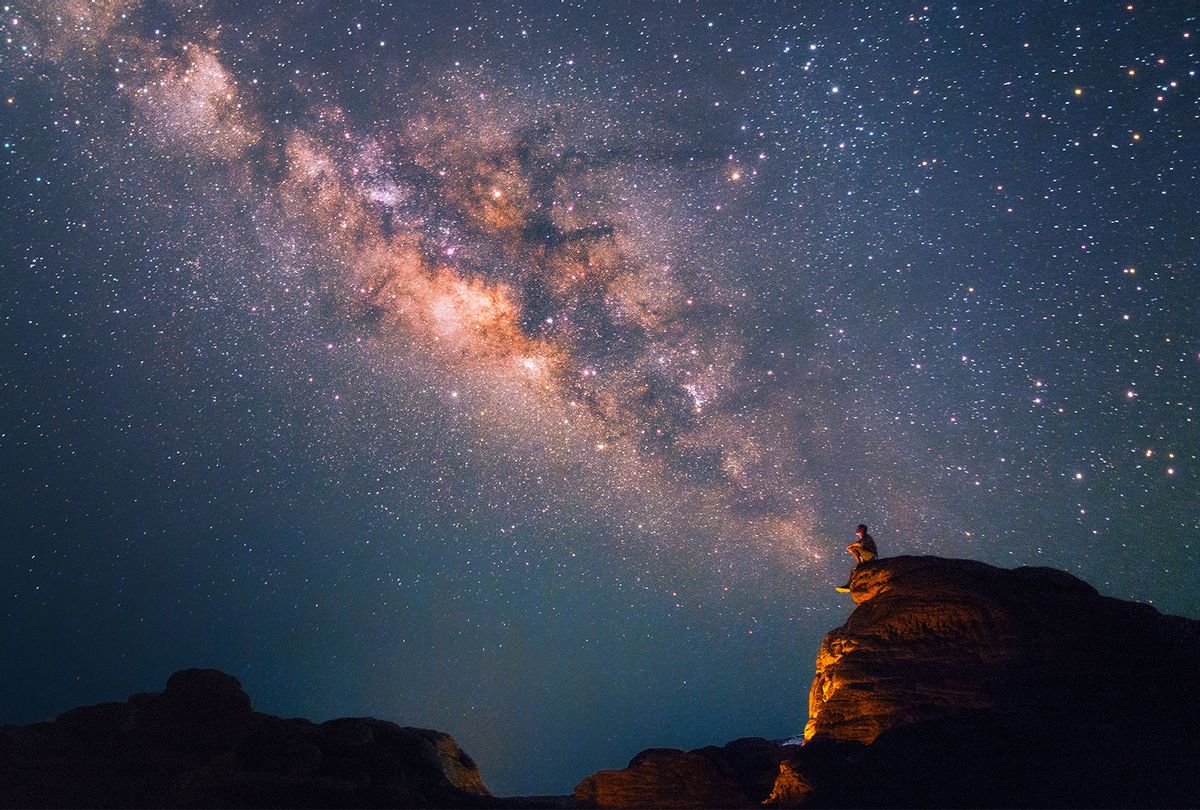 Silhouette of a man looking at the Milky Way Stars shining above (Getty Images)