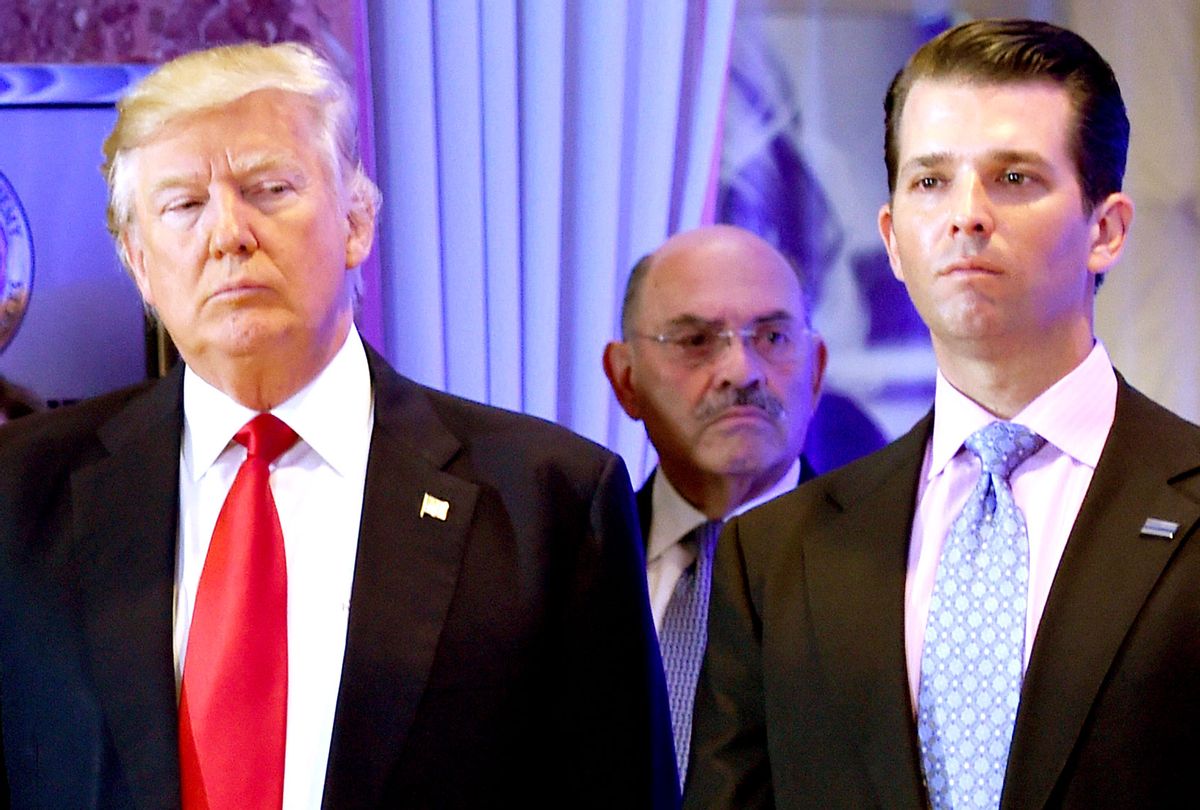 US President-elect Donald Trump along with his son Donald, Jr., arrive for a press conference at Trump Tower in New York, as Allen Weisselberg (C), chief financial officer of The Trump, looks on January 11, 2017. (TIMOTHY A. CLARY/AFP via Getty Images)