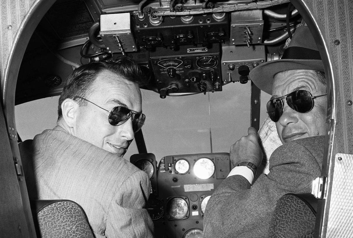 Two male pilots in the cockpit of airplane wearing sunglasses, Oklahoma, USA, 1955 (Constance Bannister Corp/Getty Images)