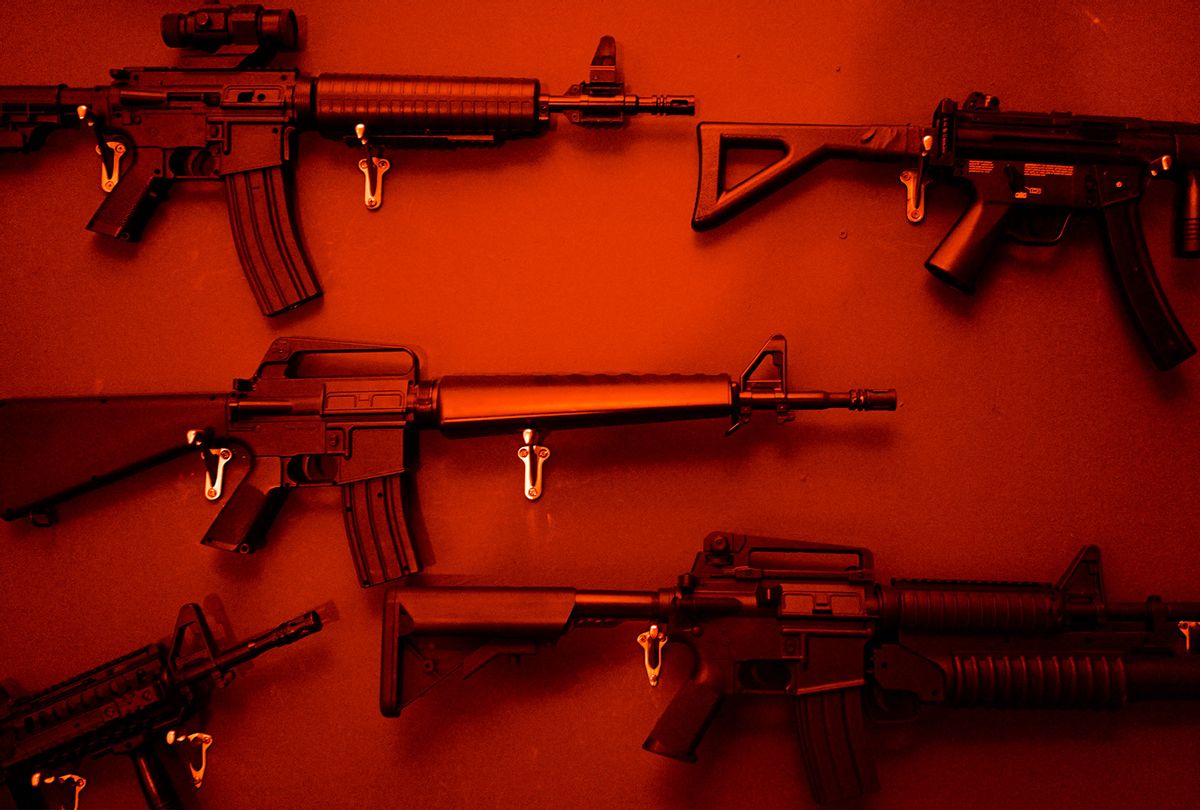 Numerous Assault Rifles Hanging On Wall (Getty Images)