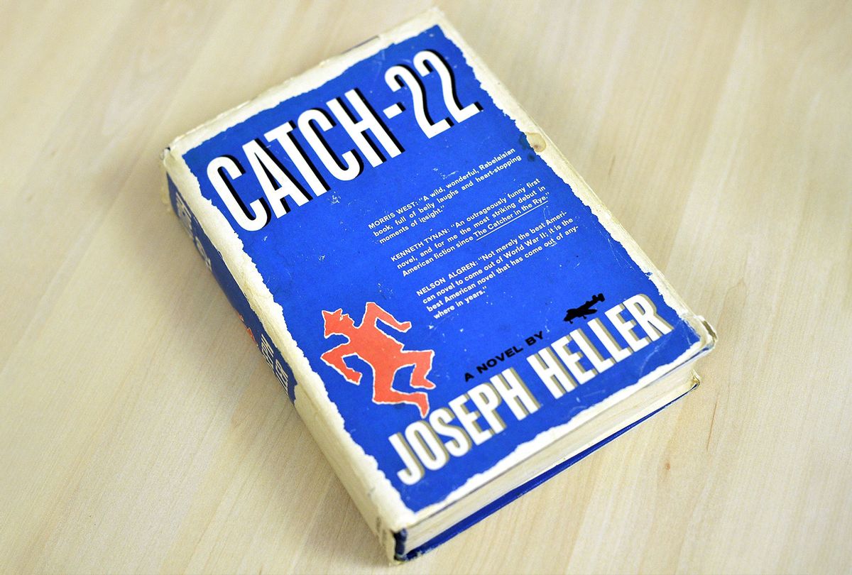 An early edition of Joseph Heller's novel "Catch-22" (NICHOLAS KAMM/AFP via Getty Images)